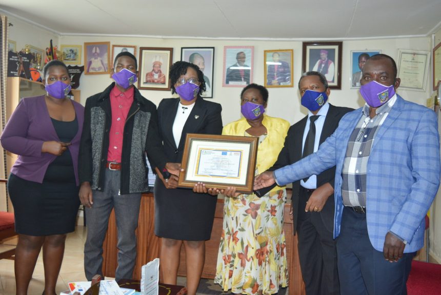 A group photo showing some Top Mgt members: Academic Registrar, Mr. Abdon Rutega , Ag. Finance Officer, Mrs. Jane Bibangambah and Director Quality Assurance, Dr. Milton Rwangire and representatives