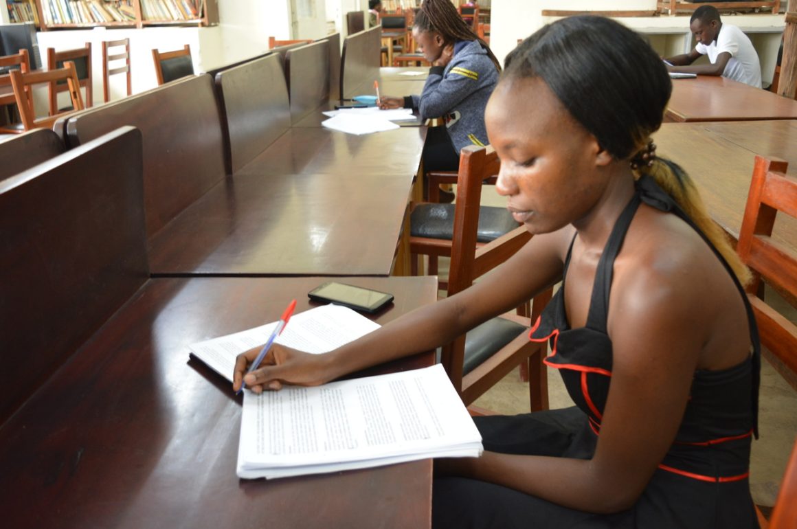 An undergraduate student revising her notes ahead of semester one examinations at Bishop Stuart University Main Library Taken: Tuesday, 08th February, 2022.