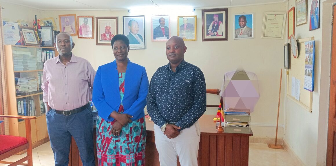 Prof. Maud Kamatenesi (C) with Dr. Michael Katurebe (L) and Mr. Ben K. Twine (R) after discussions before MoU signing