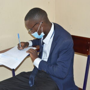 A male student writes his LLB Pre-entry Examination at the Faculty of Law, BSU on 27th September 2021