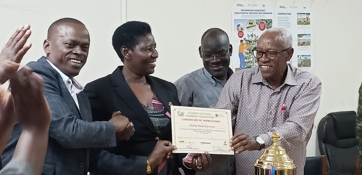 The Chairman LCV Mbarara District, Mr. Tabaro Didas (L), Prof. Maud Kamatenesi Mugisha (2nd-L) and Prof. Kenneth Kagame (R) show a certificate of appreciation presented to BSU