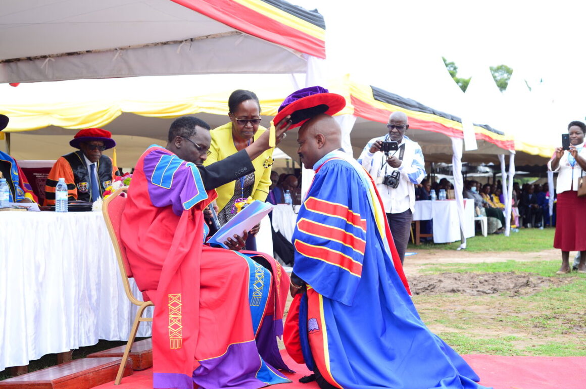 The Chancellor, Rt. Rev. Fred Sheldon Mwesigwa (PhD) - Assoc. Prof. of Religious Education, confers a Doctor of Philosophy upon Dr. Chrispo Maali during the 18th Graduation _ 24 _March _2023 The Chancellor, Rt. Rev. Fred Sheldon Mwesigwa (PhD) - Assoc. Prof. of Religious Education, confers a Doctor of Philosophy upon Dr. Chrispo Maali during the 18th Graduation _ 24 _March _2023