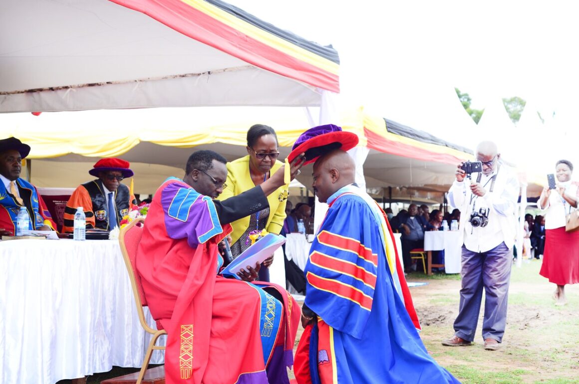 _The Chancellor, Rt. Rev. Assoc. Prof. Fred Sheldon Mwesigwa (PhD) - Assoc. Prof. of Religious Education, confers a Doctor of Philosophy upon Dr. Chrispo Maali during the 18th Graduation _ 24 _March _2023