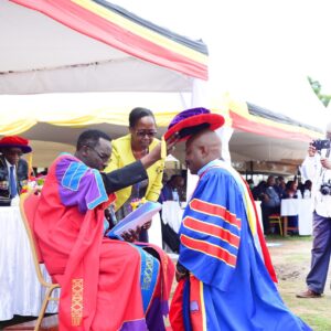 _The Chancellor, Rt. Rev. Assoc. Prof. Fred Sheldon Mwesigwa (PhD) - Assoc. Prof. of Religious Education, confers a Doctor of Philosophy upon Dr. Chrispo Maali during the 18th Graduation _ 24 _March _2023