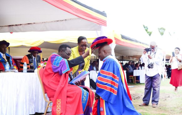 _The Chancellor, Rt. Rev. Assoc. Prof. Fred Sheldon Mwesigwa (PhD) - Assoc. Prof. of Religious Education, confers a Doctor of Philosophy upon Dr. Chrispo Maali during the 18th Graduation _ 24 _March _2023